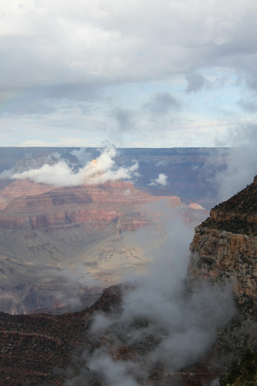 aerial photography of clouds in mountains