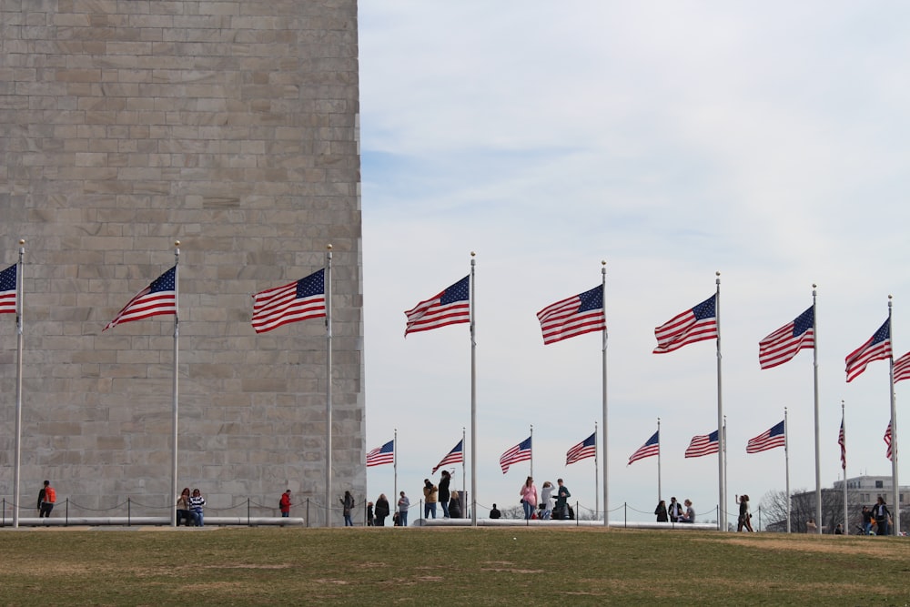 people standing near United States flag