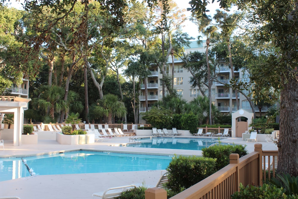 white concrete swimming pool during daytime