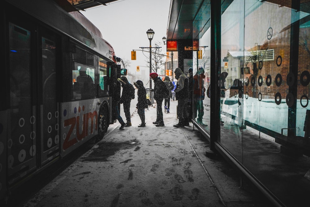 people walking towards bus