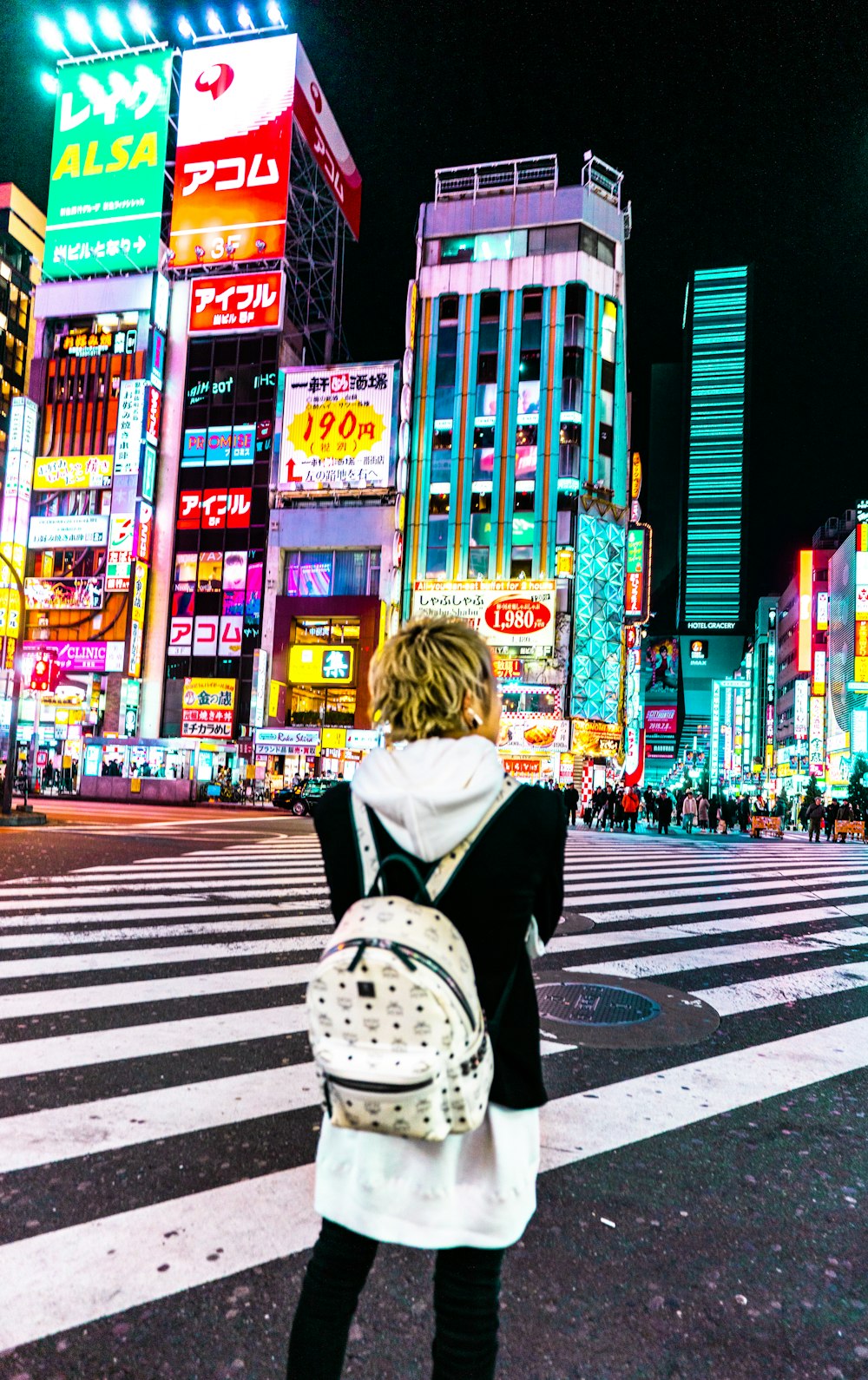 man standing near buildings