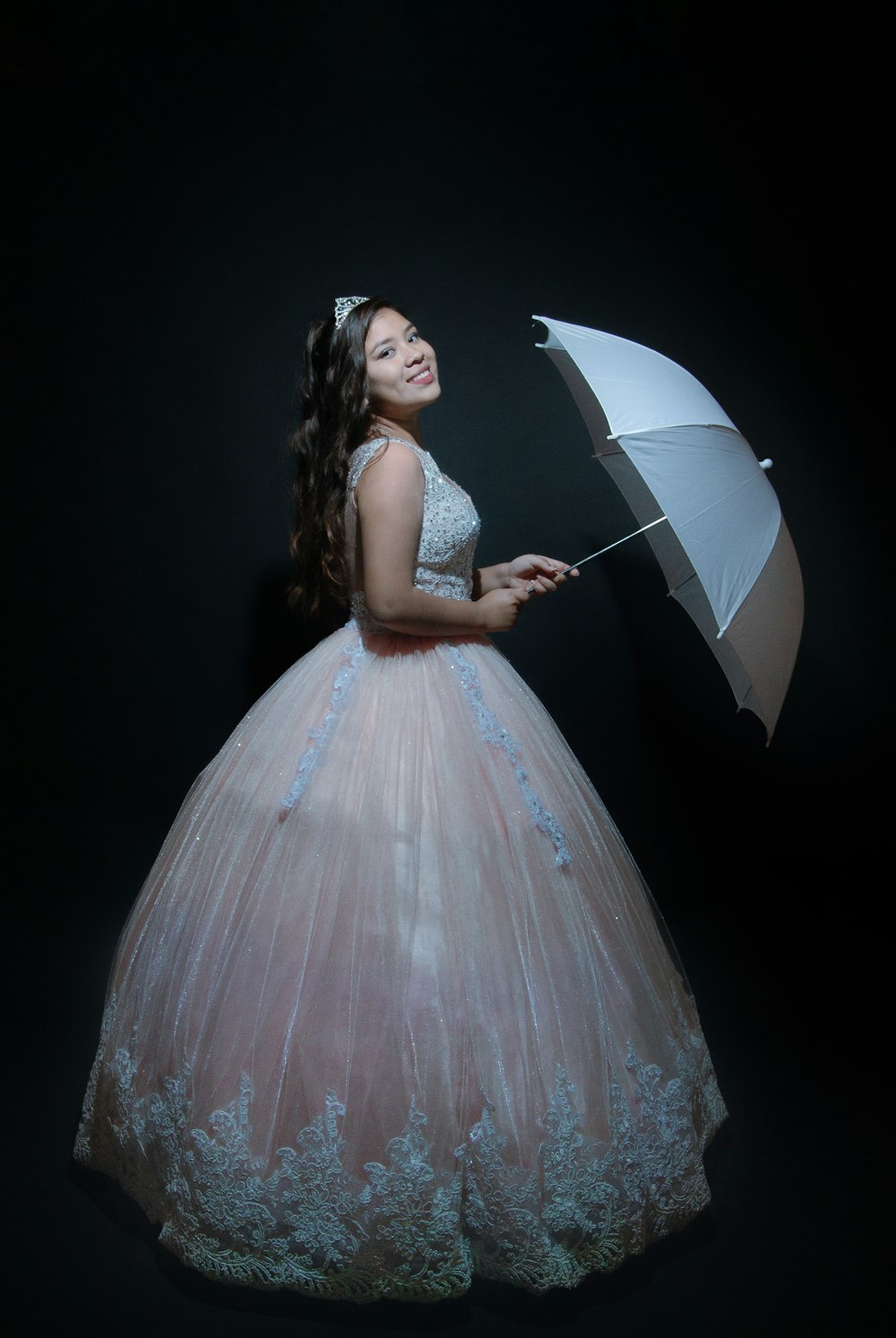 woman standing while holding umbrella