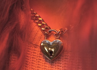 silver-colored heart pendant necklace