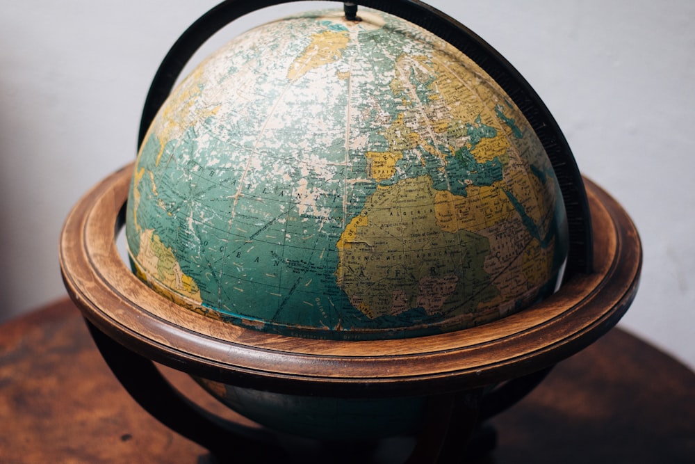 selective focus photography of terrestrial globe