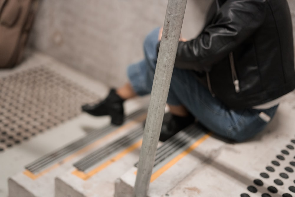 woman sitting on stairs