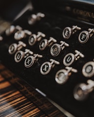 black and gray Corona typewriter