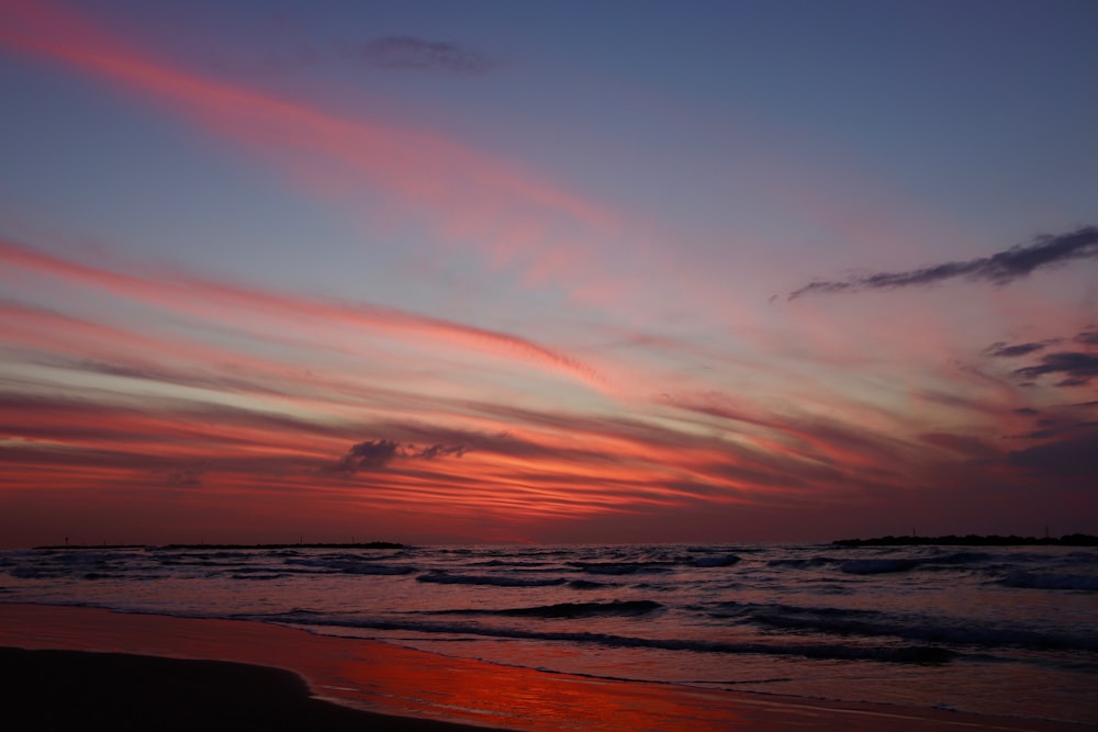 silhouette photo of sea during golden hour