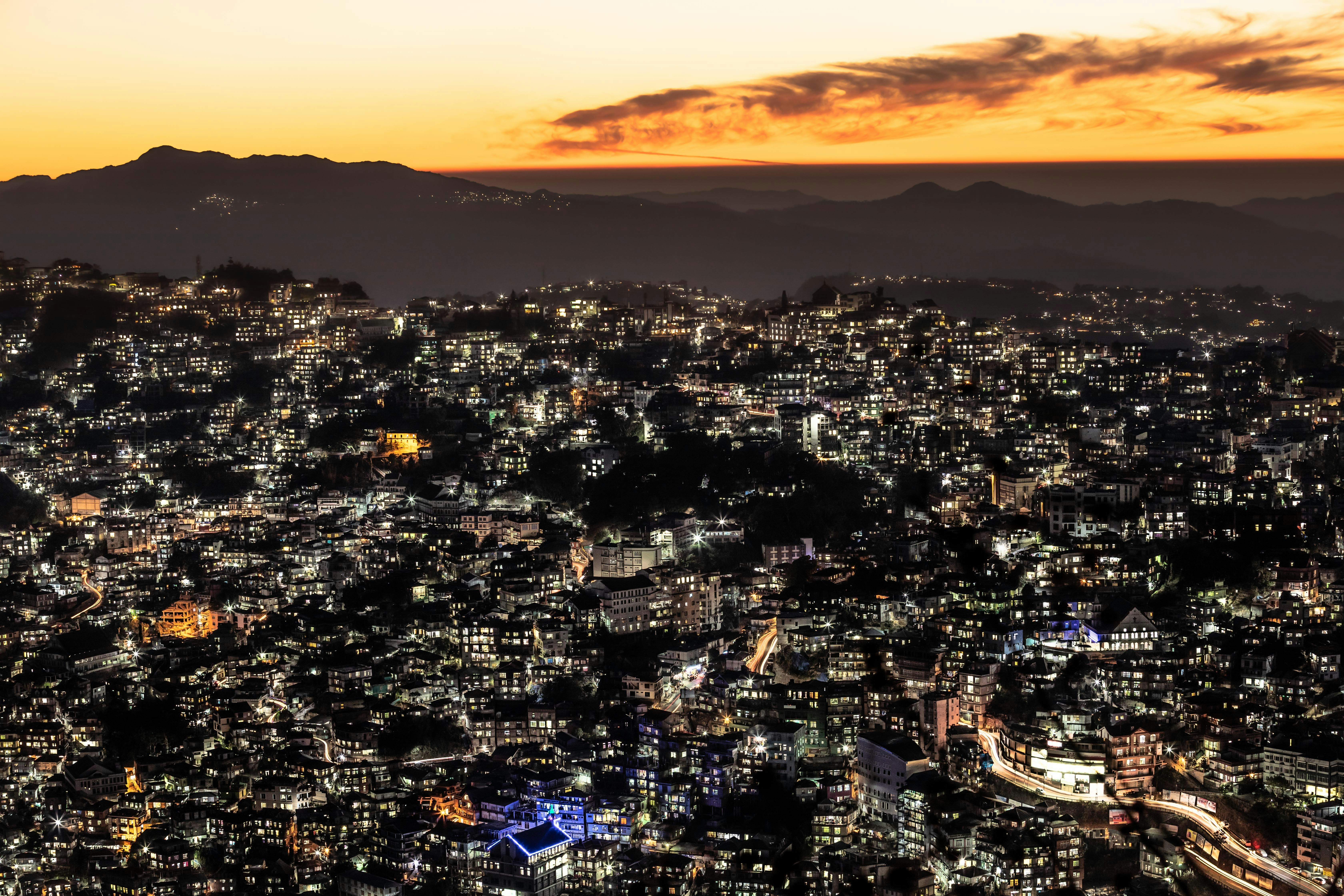 lighted buildings during sunset