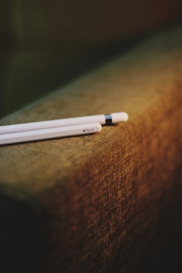 Artistic shot of the Saycolor pen’s engraved name glowing softly under warm lighting.