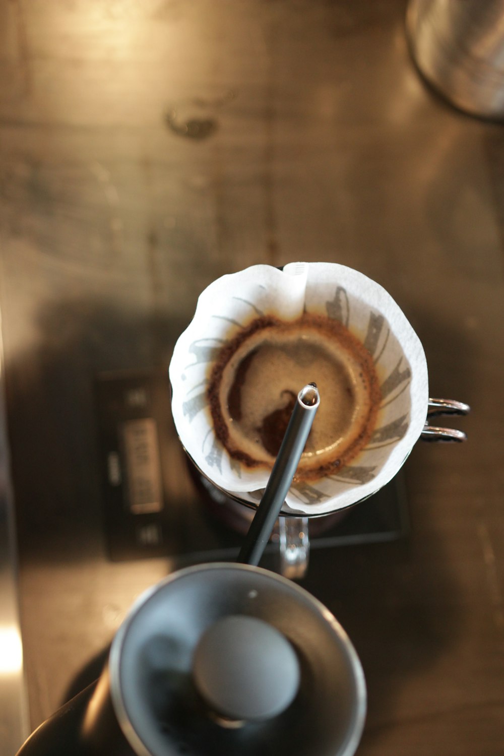 an espresso machine with a cup of coffee on top of it