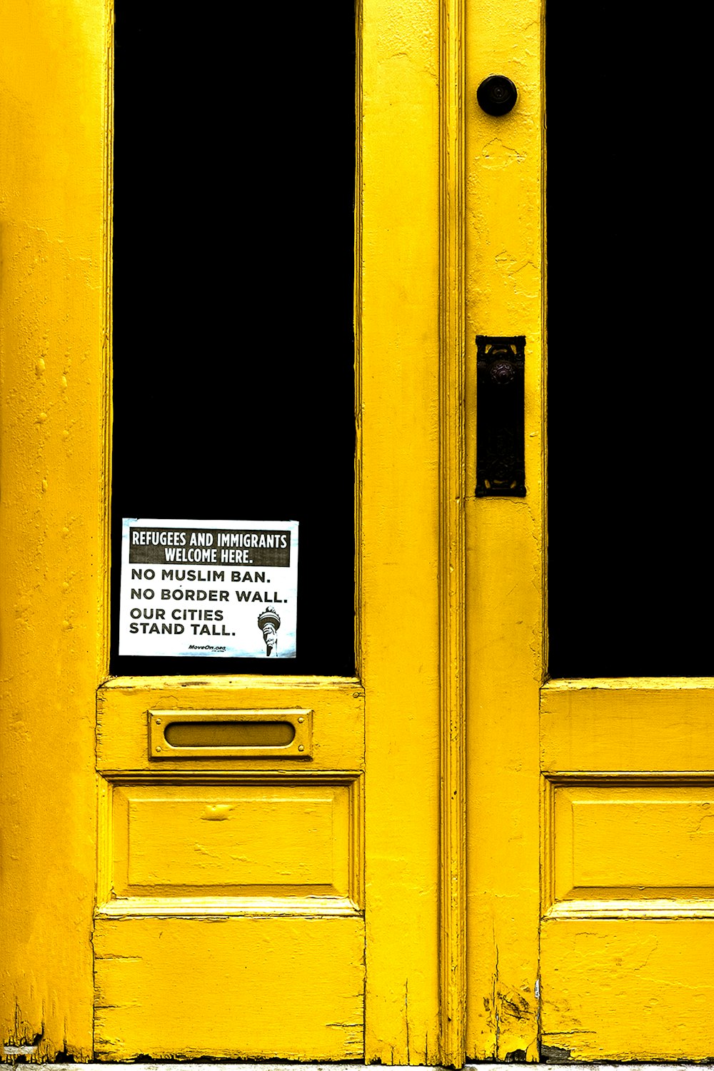 yellow wooden door during daytime