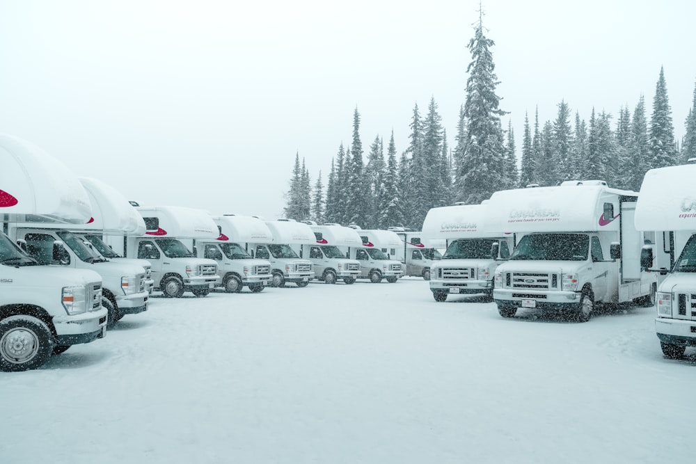white RVs on snow covered area