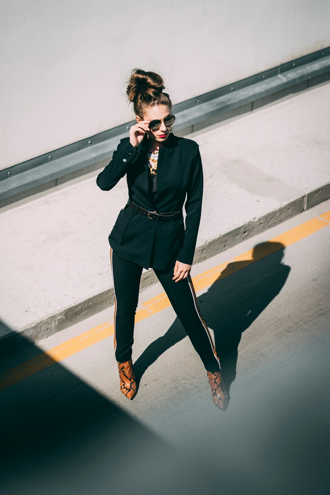 woman in black dress wearing brown sandals