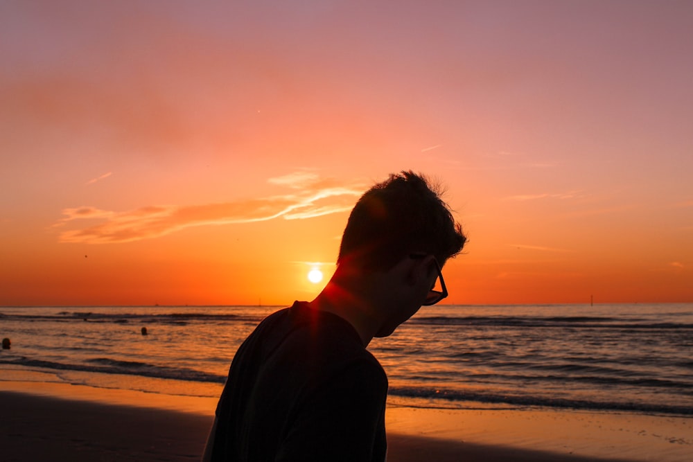silhouette photography of man on shore