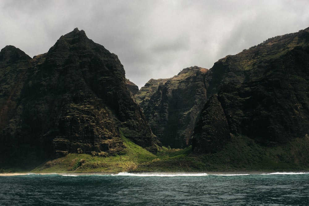 landscape photography of mountain beside body of water