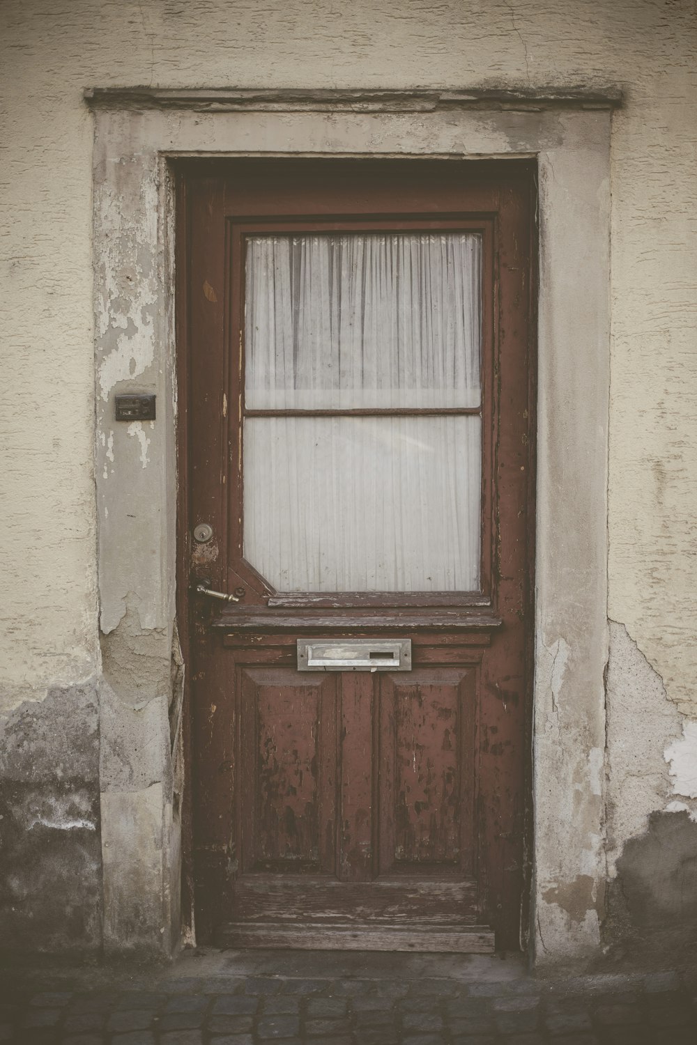 closed brown half-lite door