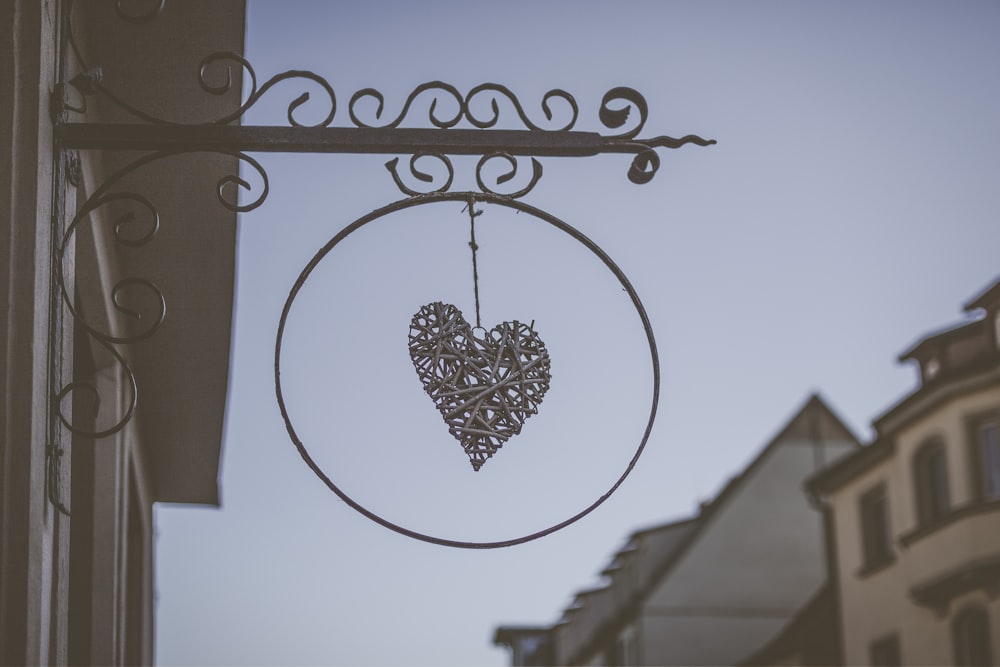 selective focus photography of heart wind chimes