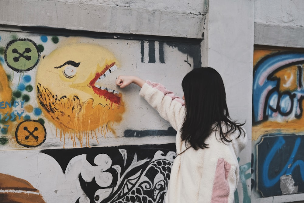 woman pointing emoji graffiti art