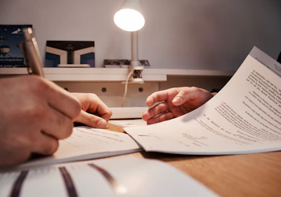 A professional lawyer reviewing civil law documents in an office.