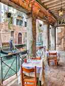 man riding on boat beside restaurant
