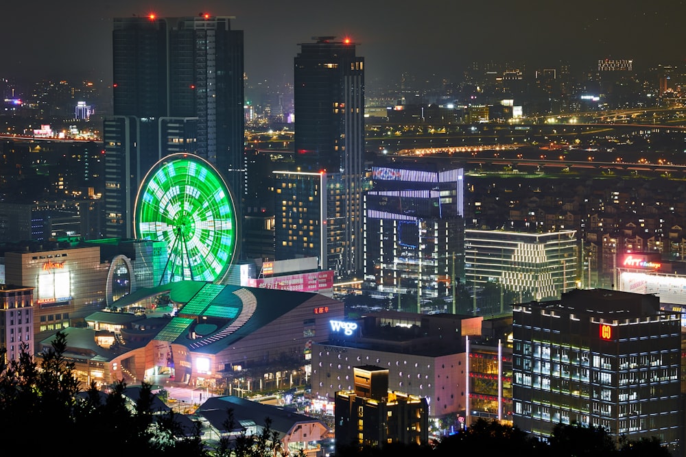 green and white ferries wheel in the city during nightime