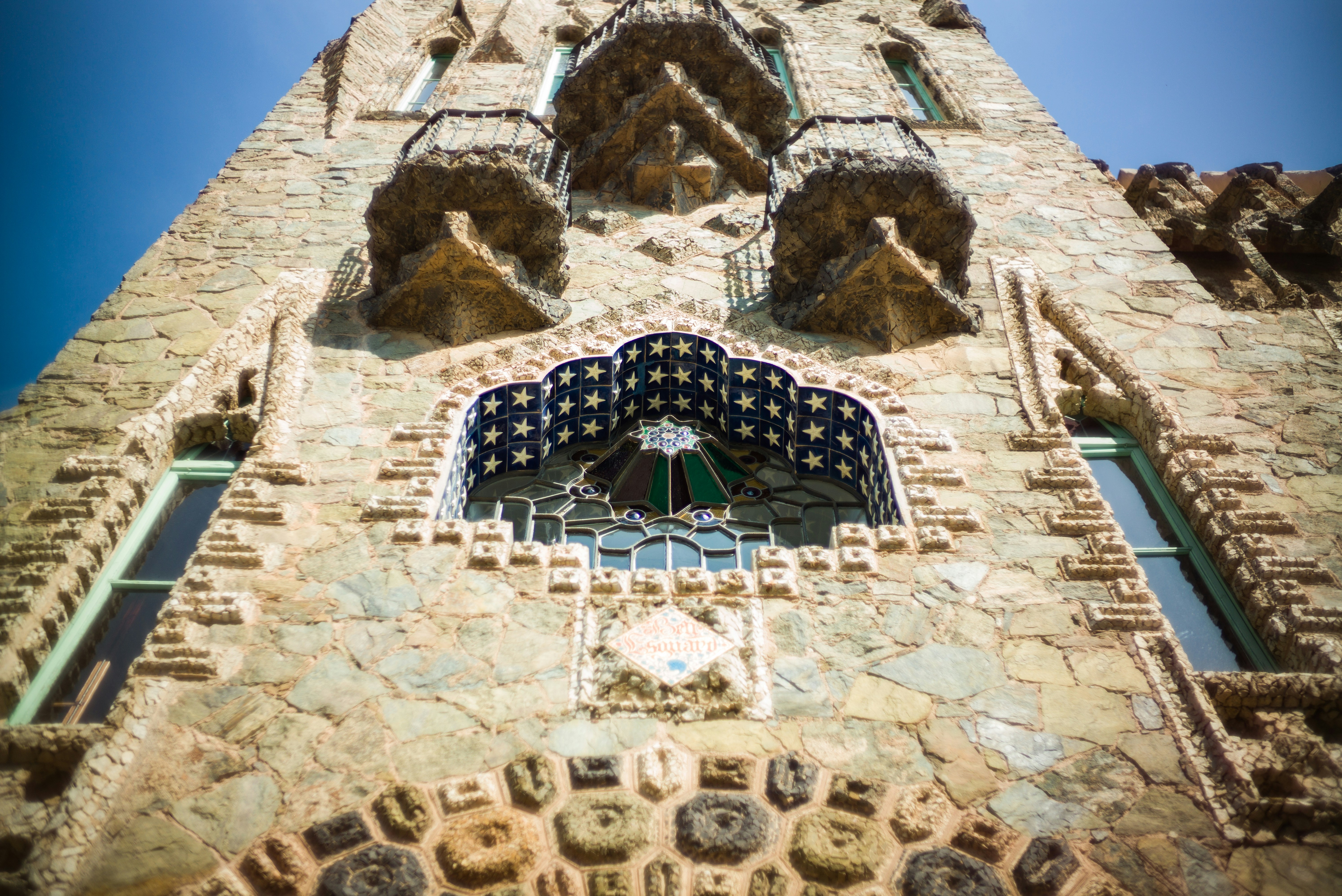 brown stone house low angle photography