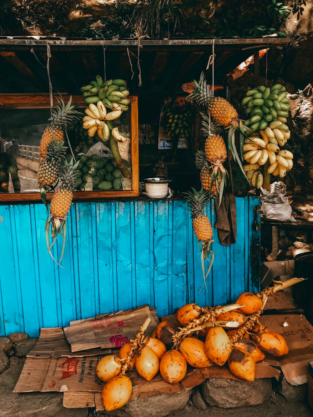 fruits hanged on string at stall during daytime