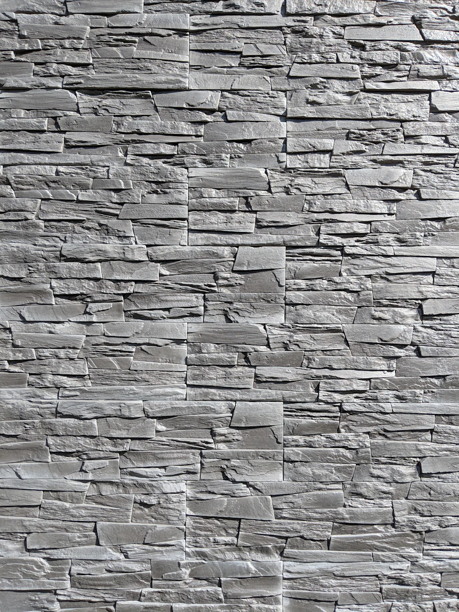 A modern gray stacked stone cladding panel.