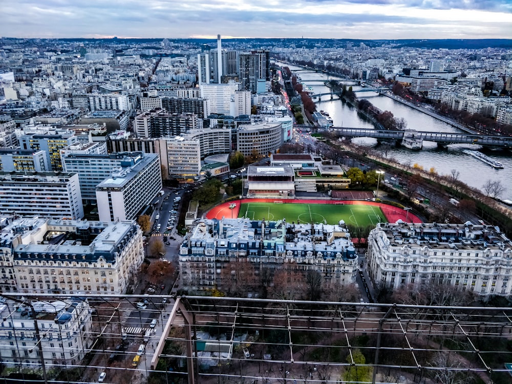 aerial photography of buildings near soccer field