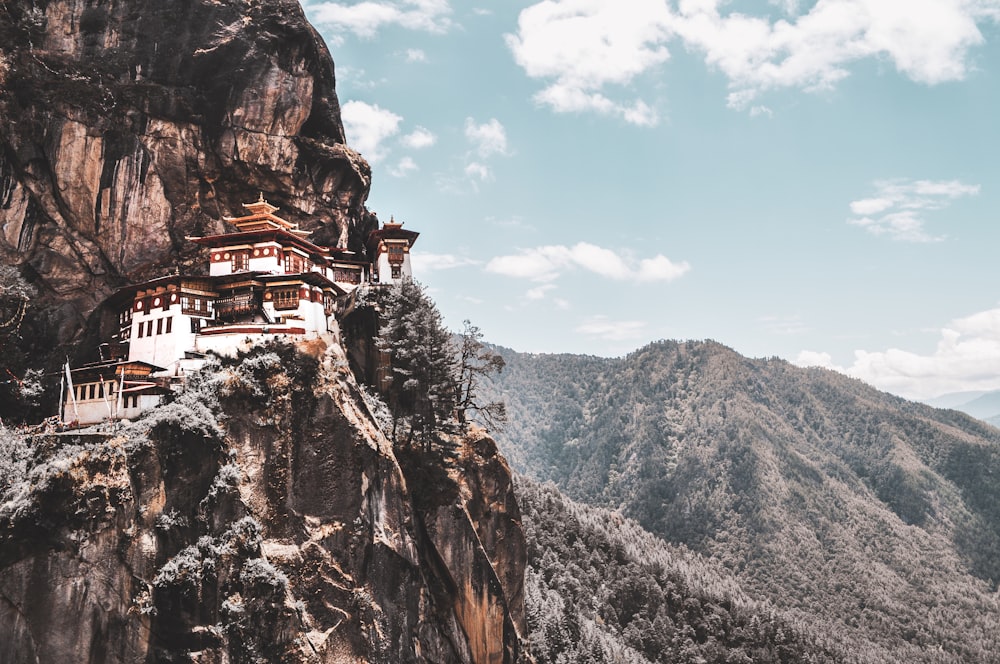 white and brown house on mountain