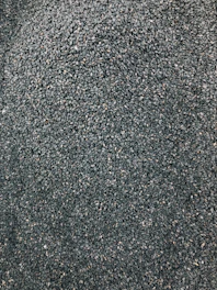 Close-up of high-quality seeds spread out on a wooden table, ready for planting.