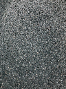 Close-up of high-quality seeds spread out on a wooden table, ready for planting.