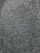 A close-up view of numerous small, dark seeds spread evenly across the entire frame.