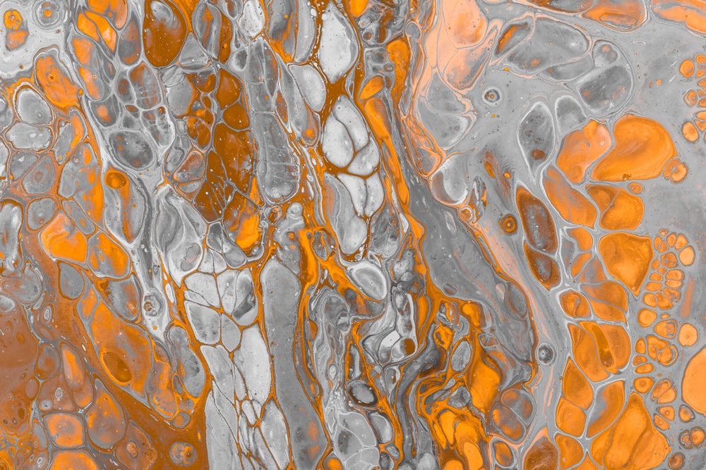 a close up of a orange and gray liquid
