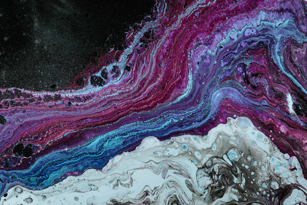 A vibrant fusion of obsidian black and neon colors swirling together, evoking cosmic energy and sonic vibrations.