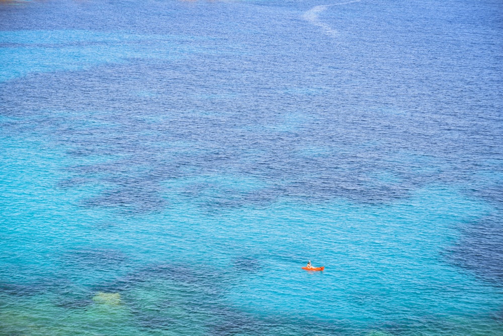 person riding on boat during daytime