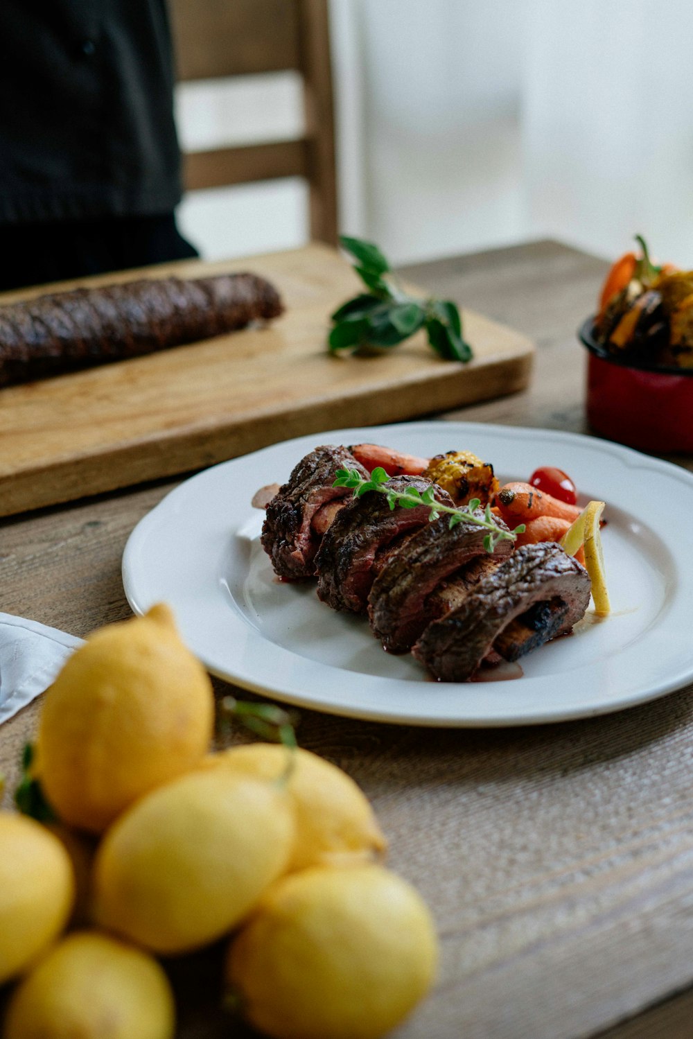 plated grilled meat on brown surface