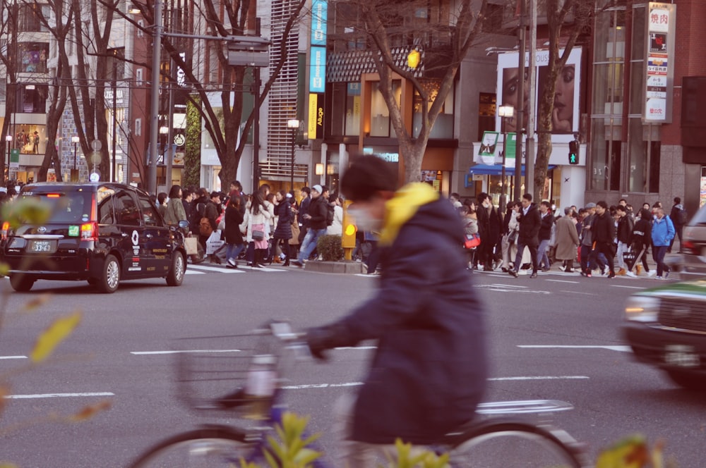 group of people walking on pedestrian lane