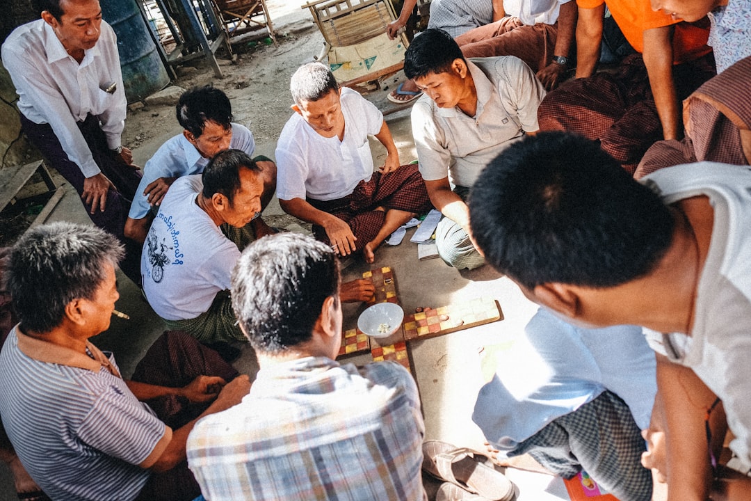 people sitting on ground during daytime