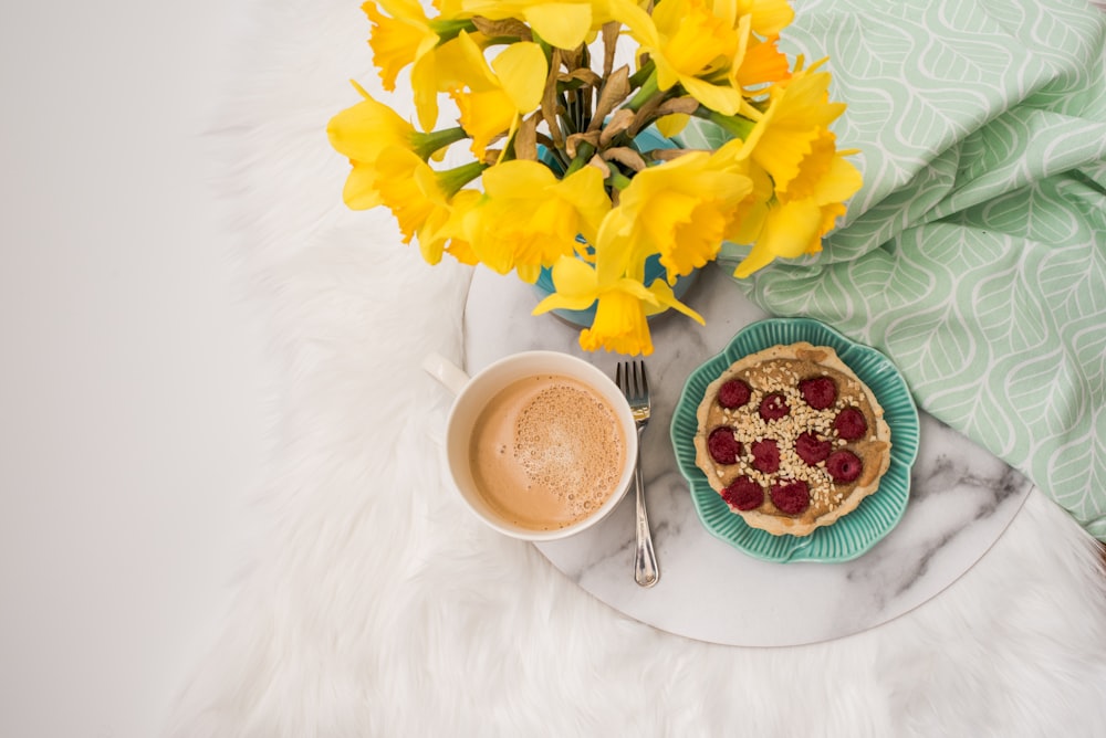 white ceramic teacup with coffee