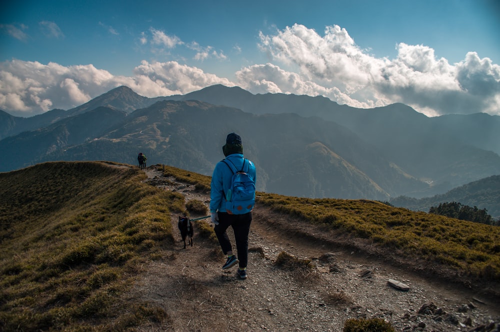 person walking on mountain