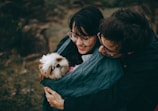 A family happily adopting a dog from the shelter.