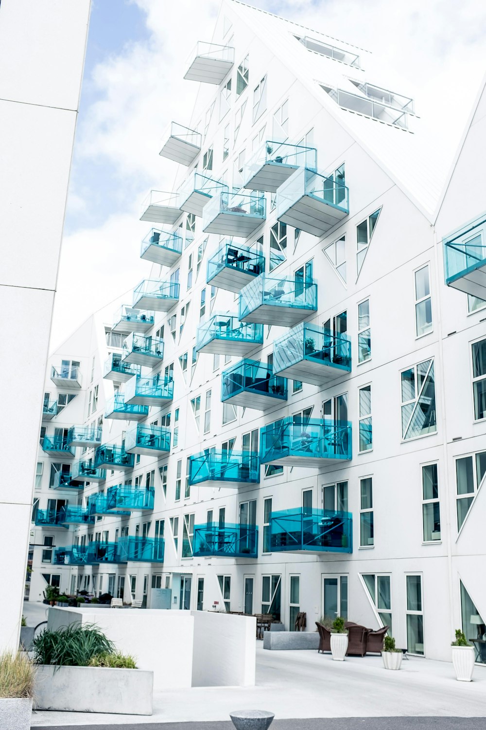 white and green concrete building under white skies