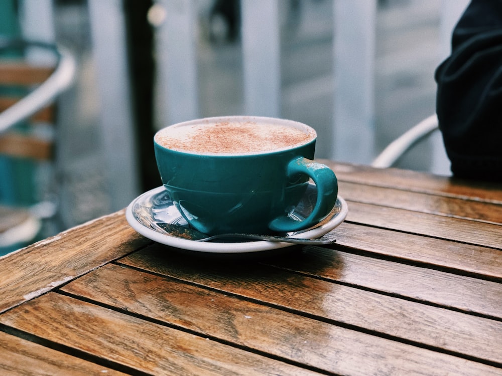 blue ceramic teacup on table