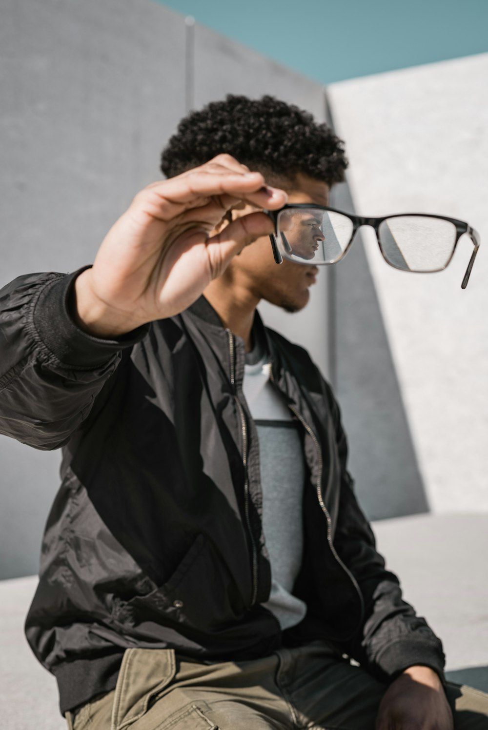 man holding eyeglasses