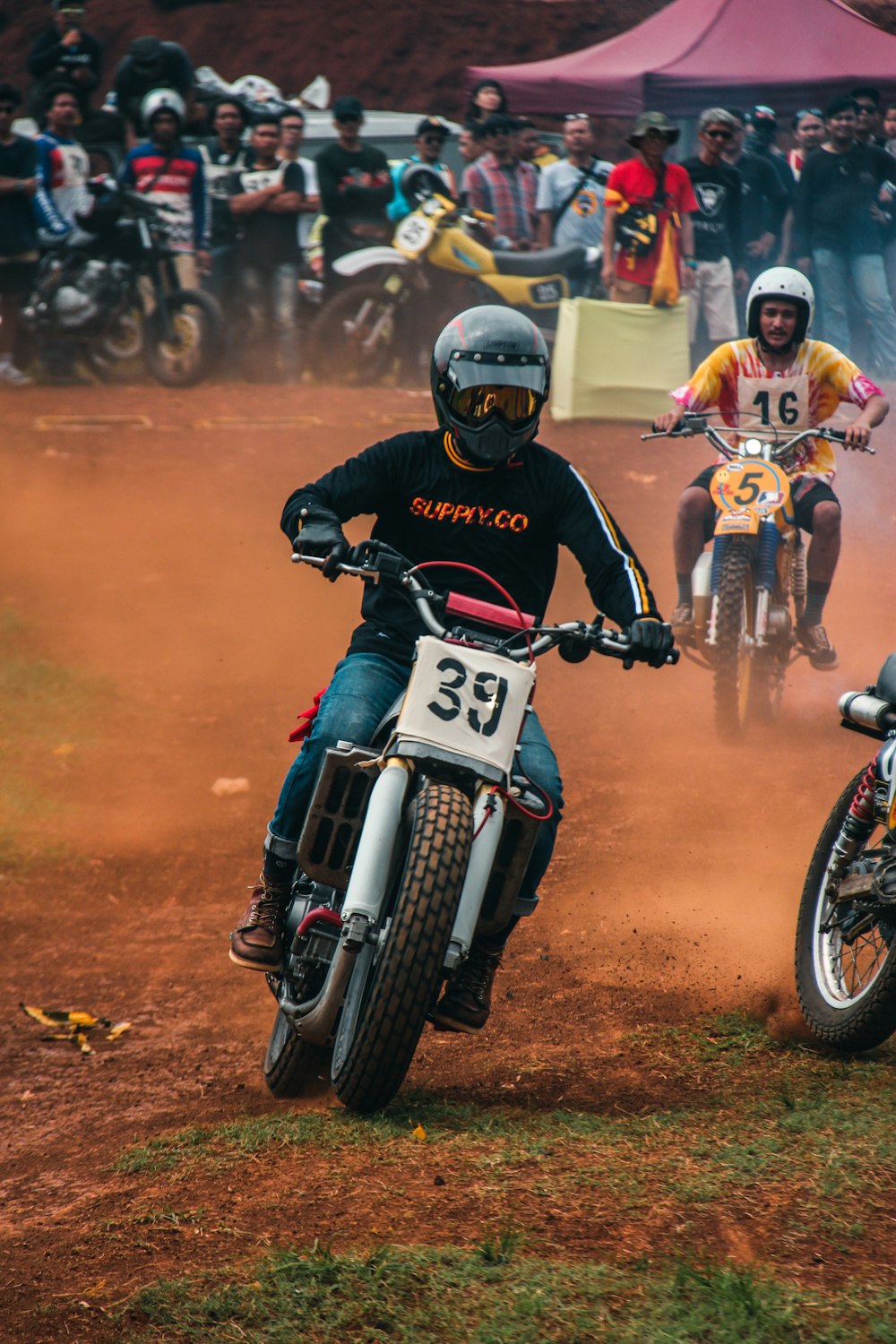 men dirt bike racing during daytime