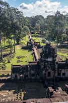 Ancient temple ruins nestled in dense jungle, bathed in morning light.