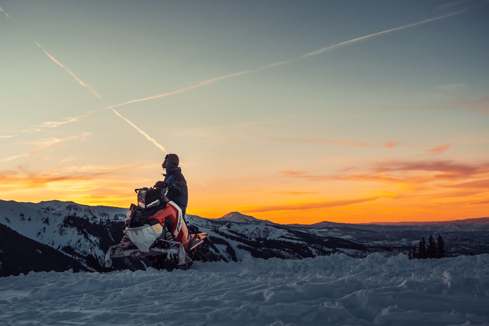 man riding snow mobile