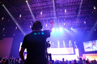 man raising his hand