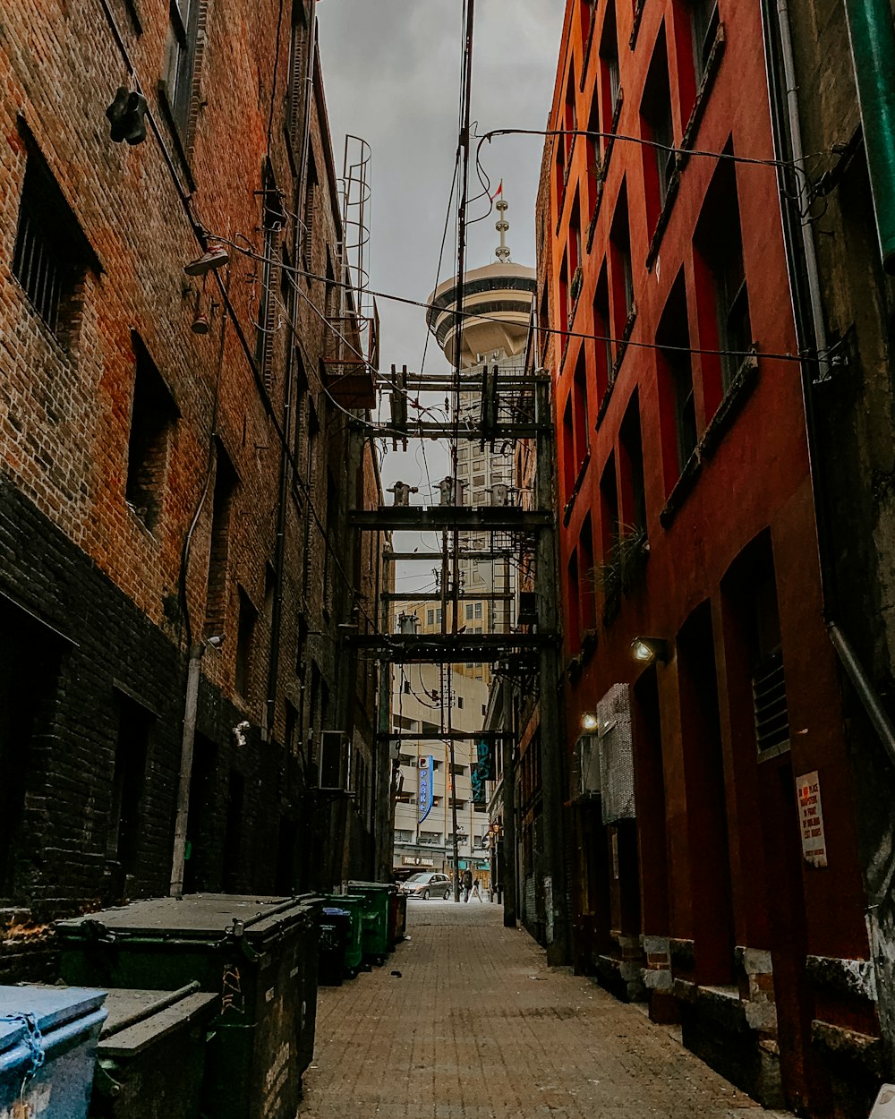 concrete pathway in between buildings